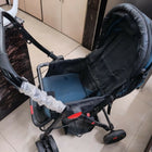 Baby stroller/pram with a foldable design, reclining seat, adjustable canopy, 5-point safety harness, smooth wheels, and spacious storage basket for safe and comfortable travel with babies and toddlers.