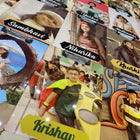 Collection of name cards with various names and images on a table.