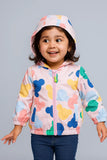 Child wearing a colorful jacket with cartoon character patterns 
