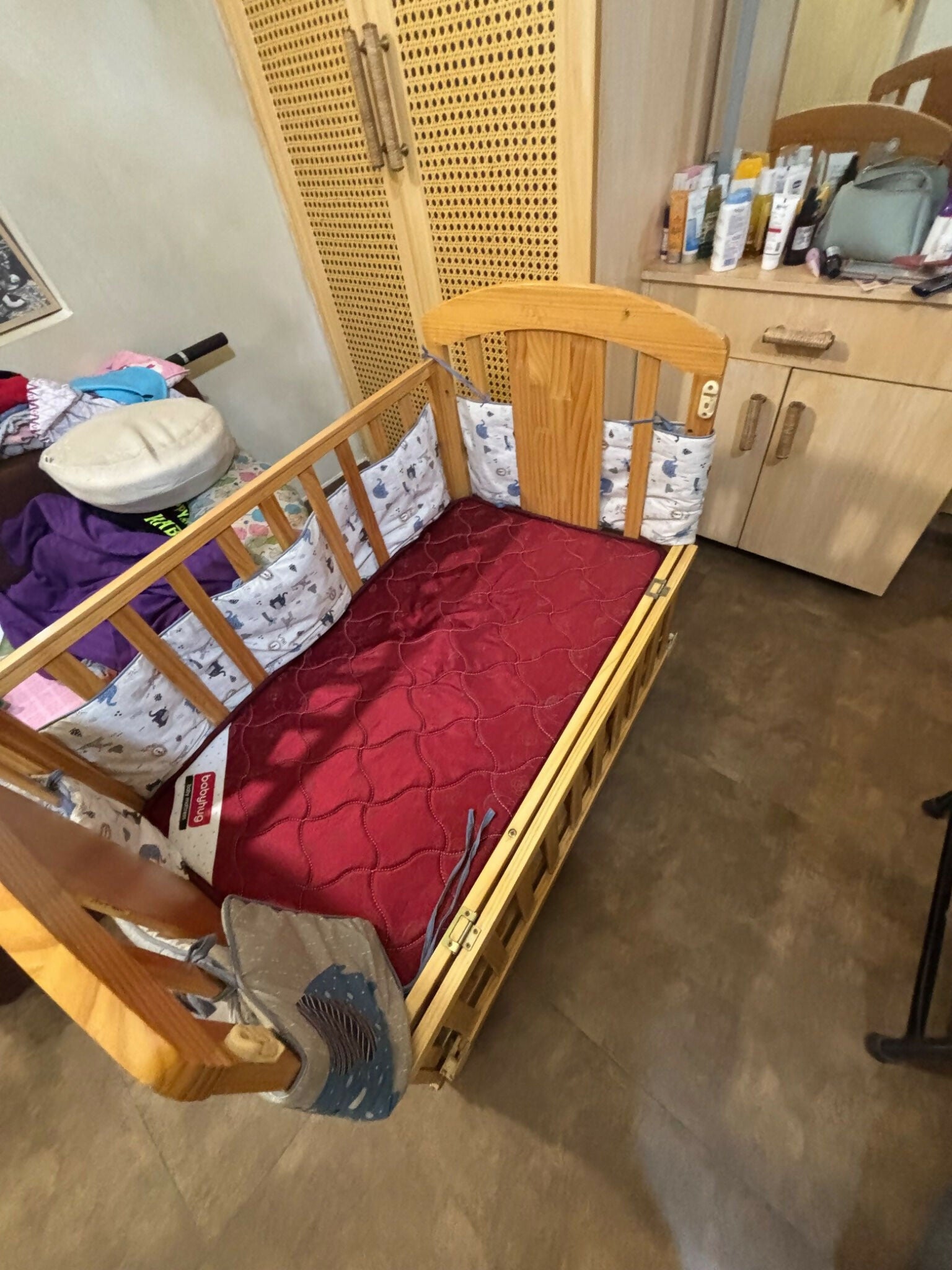 Baby cot/crib with a sturdy construction, comfortable sleeping space, smooth rounded edges, adjustable mattress support, and a safe design for newborns and growing babies.