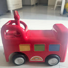 ELC Happyland Ride-On Bus with a colorful bus-inspired design, comfortable seat, sturdy wheels, easy-grip steering handle, and durable construction for fun indoor and outdoor riding play.