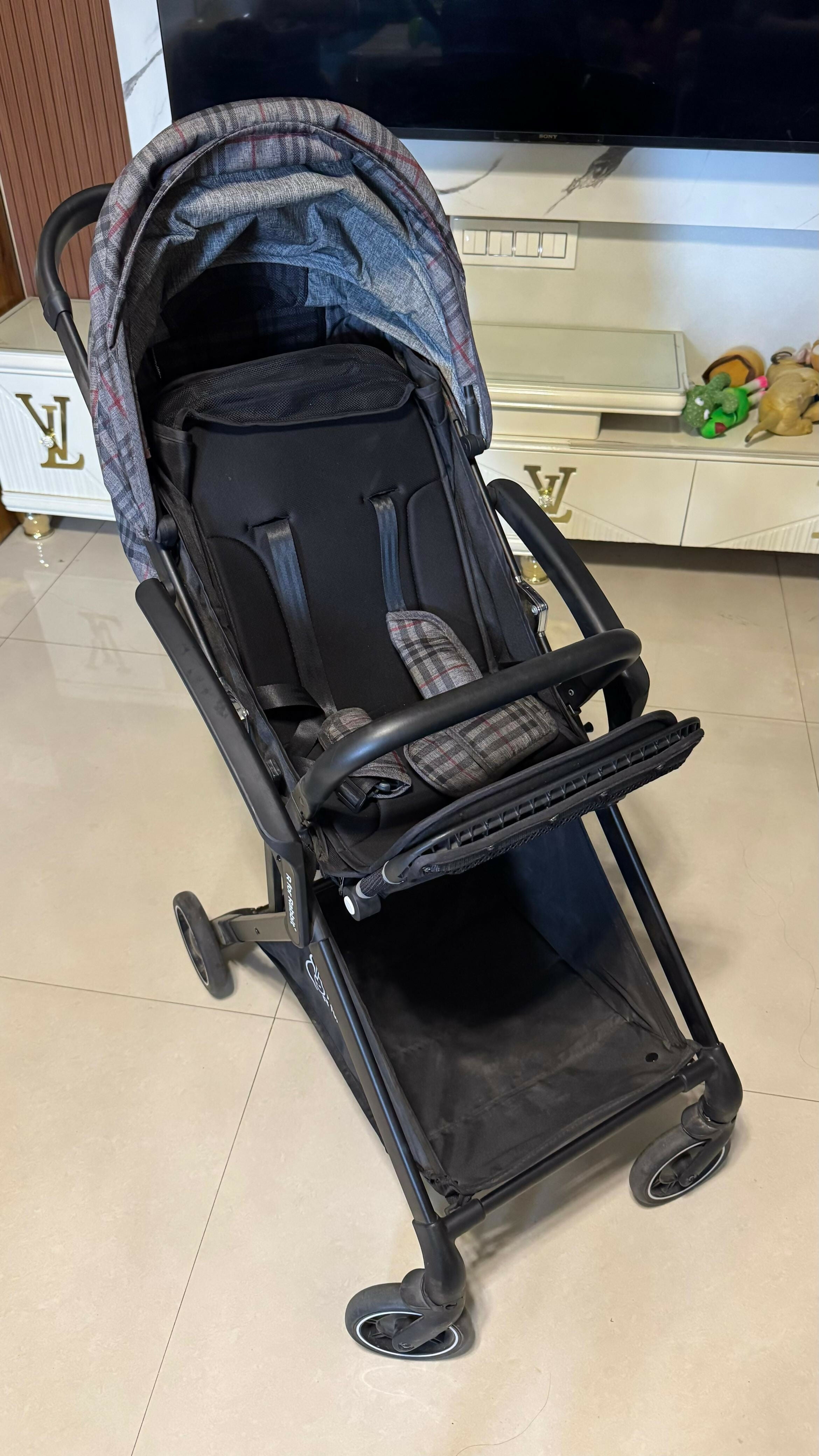 R FOR RABBIT Street Smart Nova Kids Stroller in Blue Black, Almost New condition, featuring comfortable seating, a travel-friendly design, protective canopy, safety harness, and smooth wheels for convenient everyday outings.