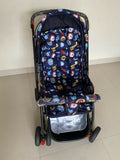 Babyhug Baby Stroller with a lightweight foldable frame, reclining seat, adjustable canopy, safety harness, smooth wheels, and storage basket for comfortable everyday outings with babies and toddlers.