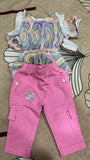 Colorful top and pink pants 