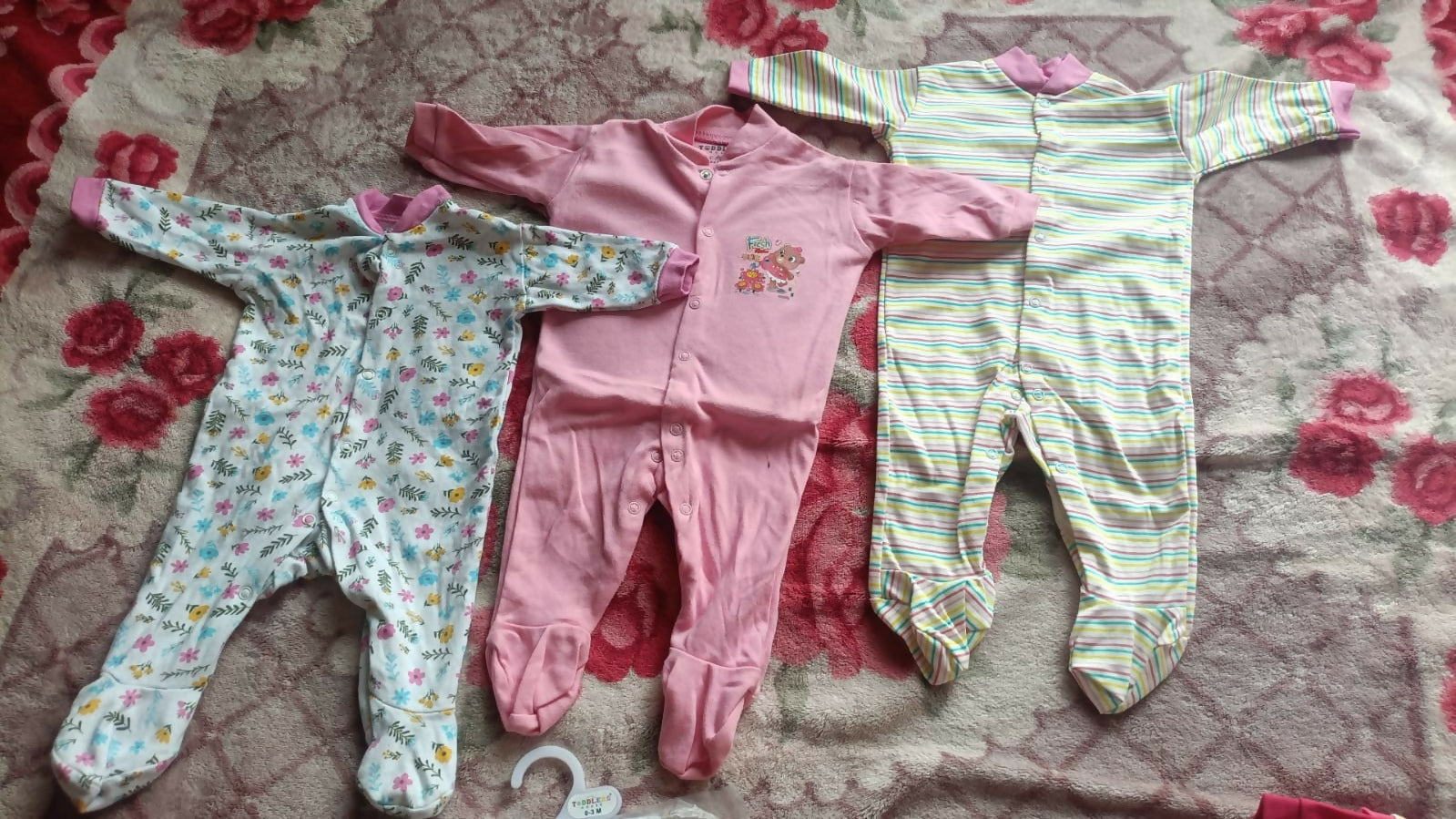 Set of 3 baby rompers in pink, floral print and pastel stripes, soft fabric, almost new condition
