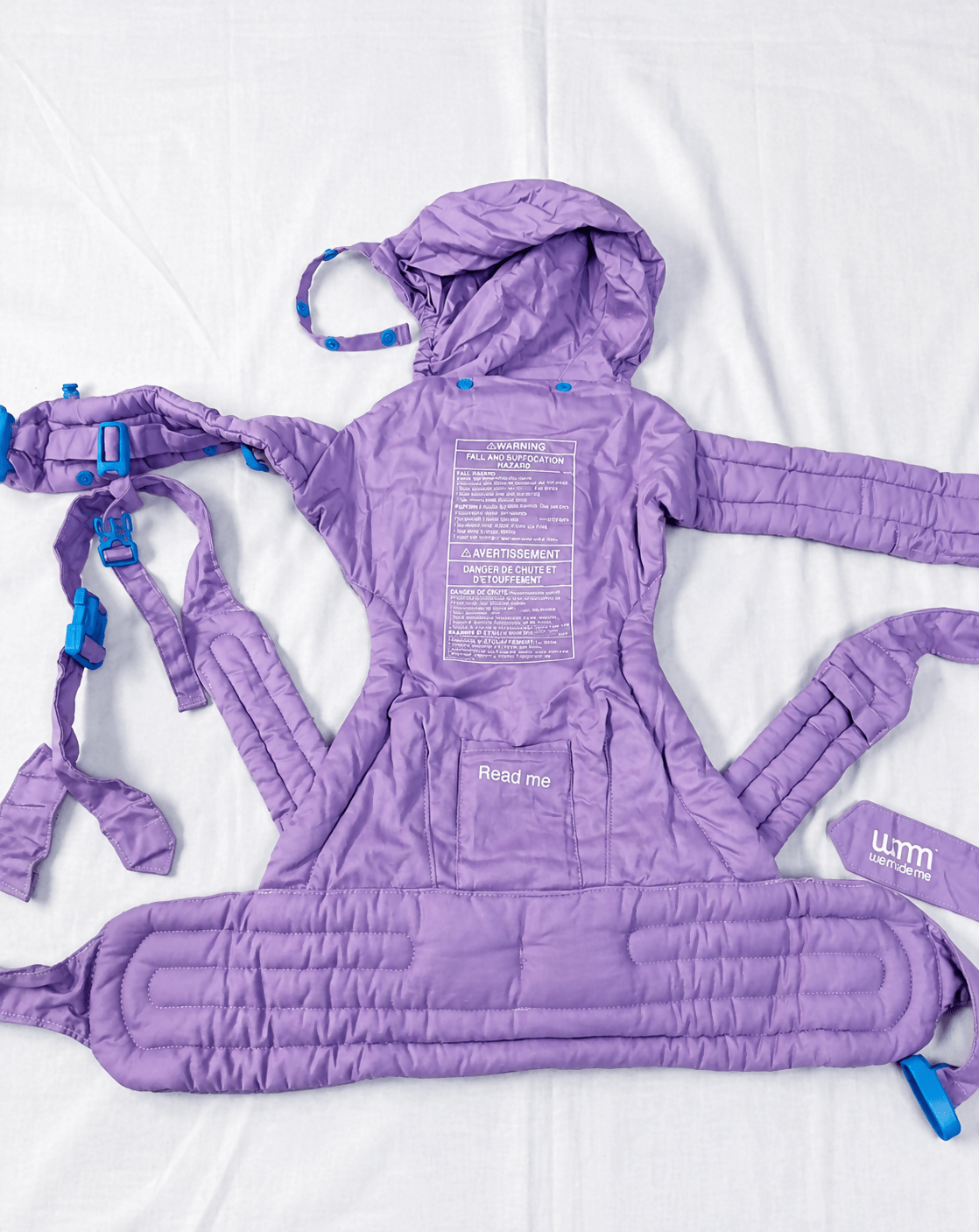 We Made Me Pao Papoose Three 3-in-1 Baby Carrier in Purple with multiple carrying positions, padded shoulder straps, adjustable waist belt, ergonomic support, and breathable fabric for comfortable babywearing.