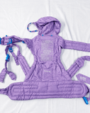 We Made Me Pao Papoose Three 3-in-1 Baby Carrier in Purple with multiple carrying positions, padded shoulder straps, adjustable waist belt, ergonomic support, and breathable fabric for comfortable babywearing.