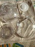 SOLYYMOMS Smart Wearable Breast Pump in Preloved New condition featuring a compact hands-free design, adjustable pumping settings and comfortable fit for convenient breast milk expression at home, work or while travelling.
