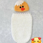 Shop now for our Child Safe Acrylic Yarn Cocoon + Cap set, offering warmth, safety, and adorable style for your newborn!