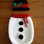 Shop now for our Child Safe Acrylic Yarn Cocoon + Cap set, offering warmth, safety, and adorable style for your newborn!