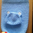 Shop now for our Child Safe Acrylic Yarn Cocoon + Cap set, offering warmth, safety, and adorable style for your newborn!