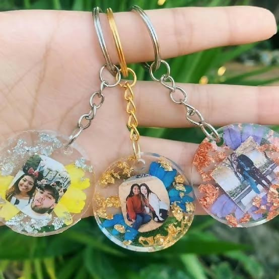 Three keychains with embedded photos 