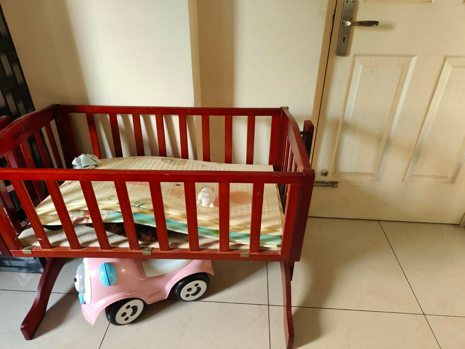 LuvLap wooden cradle with a sturdy wooden frame, gentle rocking motion, protective side rails, and a spacious sleeping area for safe and comfortable rest for newborns and infants.