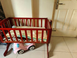 LuvLap wooden cradle with a sturdy wooden frame, gentle rocking motion, protective side rails, and a spacious sleeping area for safe and comfortable rest for newborns and infants.