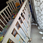Wooden baby crib with storage, mattress, and bumper featuring sturdy wooden construction, spacious sleeping area, built-in storage, protective bumpers, and comfortable support for babies.