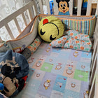 Wooden baby crib with storage, mattress, and bumper featuring sturdy wooden construction, spacious sleeping area, built-in storage, protective bumpers, and comfortable support for babies.