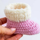 Handmade baby booties and beanie set, customizable with premium yarn for warmth, comfort, and a personal touch.
