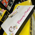 Children's desk mat with unicorn design and 'Princess Maria' text on a yellow surface.