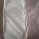 White eye mask on a patterned fabric background