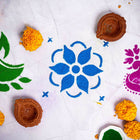 Elevate your festive celebrations with our DIY Rangoli Kit, a delightful set designed to add a touch of artistry and tradition to your home. This kit includes everything you need to create a beautiful rangoli, including a traditional stencil, six vibrant rangoli colors, and a charming diya.