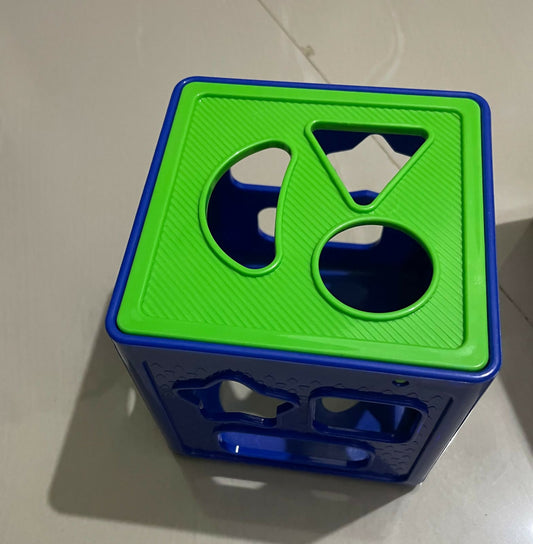Inspire your child's early learning journey with the Ratnas Shape Sorter Cube Junior, a captivating toy that combines fun and education to help your little one develop essential skills while exploring shapes and colors.