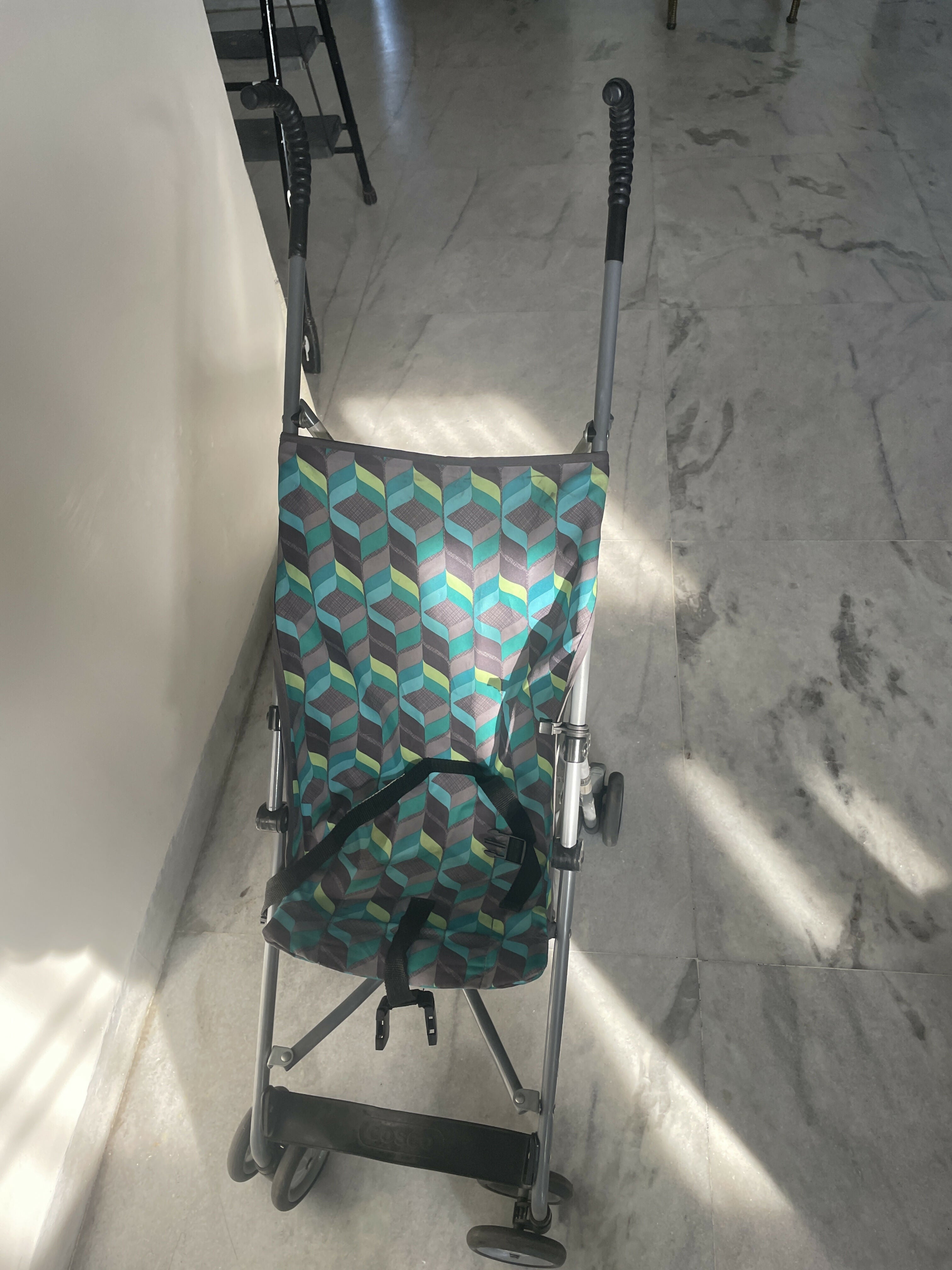 Patterned folding cart on a marble floor