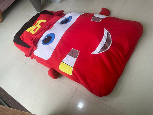 Transform bedtime into a thrilling adventure with the Red Toy Car Bed with Attached Blanket – a vibrant and cozy race car bed that ensures your child stays warm and secure all night.