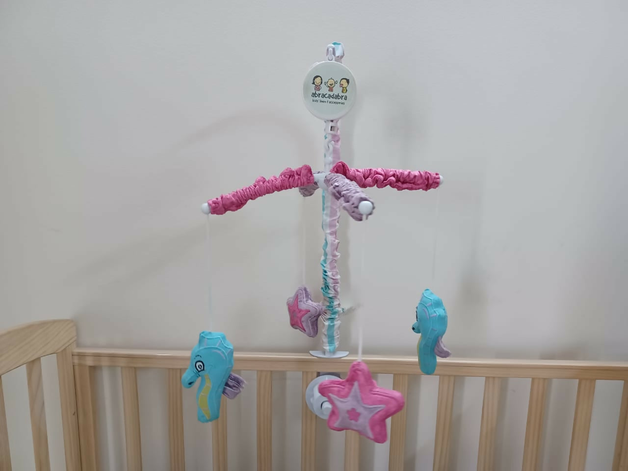 Soothe your baby to sleep with the enchanting Abracadabra Musical Cot Mobile—featuring adorable mermaids, soft melodies, and calming motion!