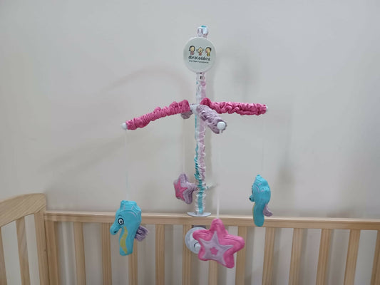 Soothe your baby to sleep with the enchanting Abracadabra Musical Cot Mobile—featuring adorable mermaids, soft melodies, and calming motion!