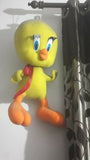 Plush toy of a yellow bird with a red bow tie
