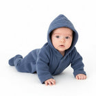 Baby wearing a blue hooded onesie 