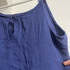Blue dress on a hanger against a white background