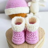 Handmade baby booties and beanie set, customizable with premium yarn for warmth, comfort, and a personal touch.