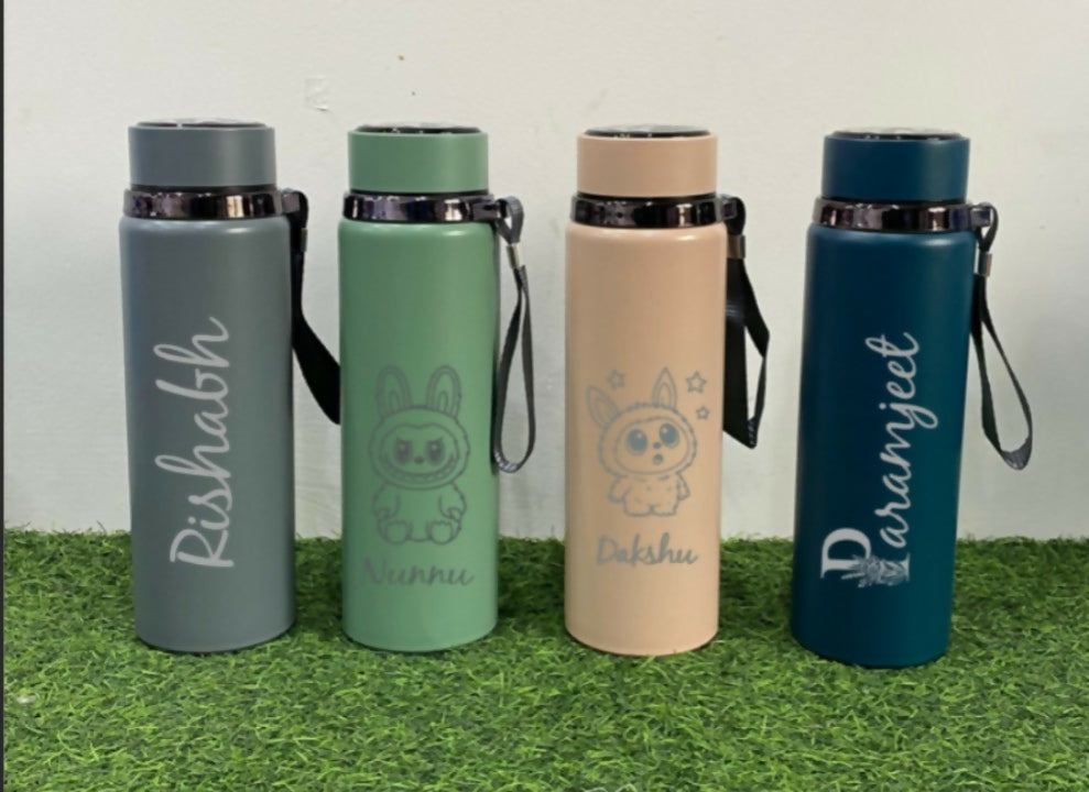 Four insulated water bottles with names and designs 