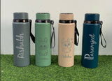 Four insulated water bottles with names and designs 