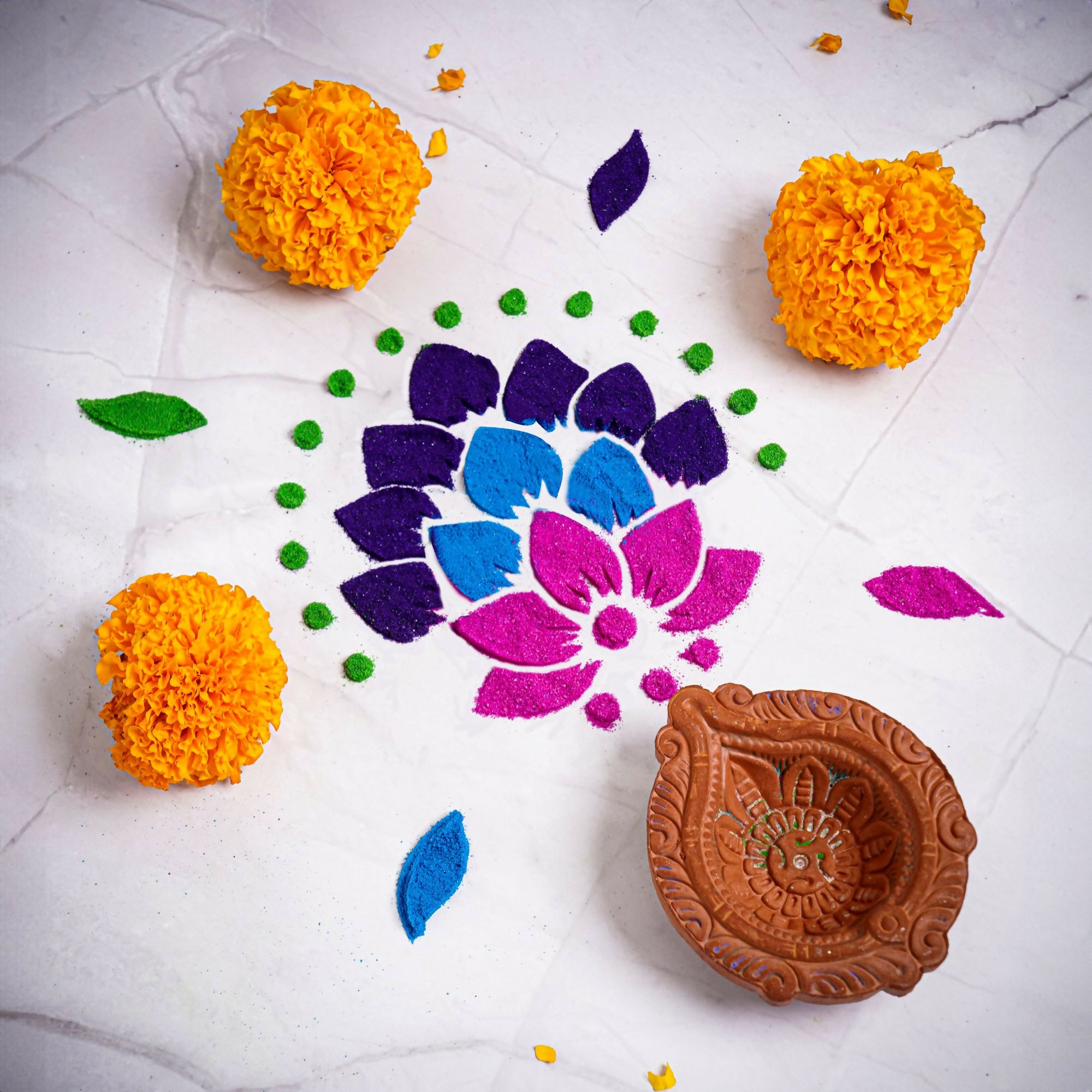 Elevate your festive celebrations with our DIY Rangoli Kit, a delightful set designed to add a touch of artistry and tradition to your home. This kit includes everything you need to create a beautiful rangoli, including a traditional stencil, six vibrant rangoli colors, and a charming diya.