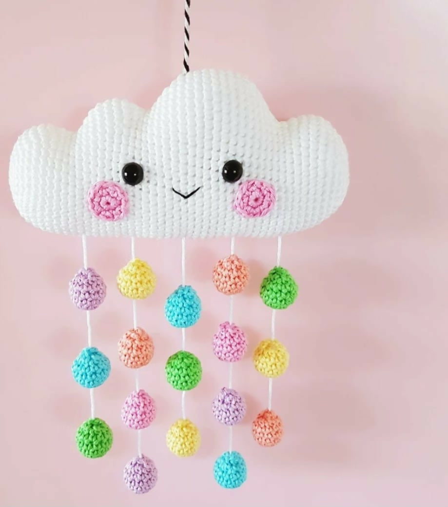 Discover our handcrafted Crochet Cloud Wall/Cradle Hanger, designed to elevate your baby's nursery with its soft, durable yarn and charming cloud motif.