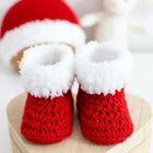 Handmade baby booties and beanie set, customizable with premium yarn for warmth, comfort, and a personal touch.