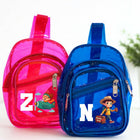 Pink and blue transparent mini backpacks with cartoon characters on a white background