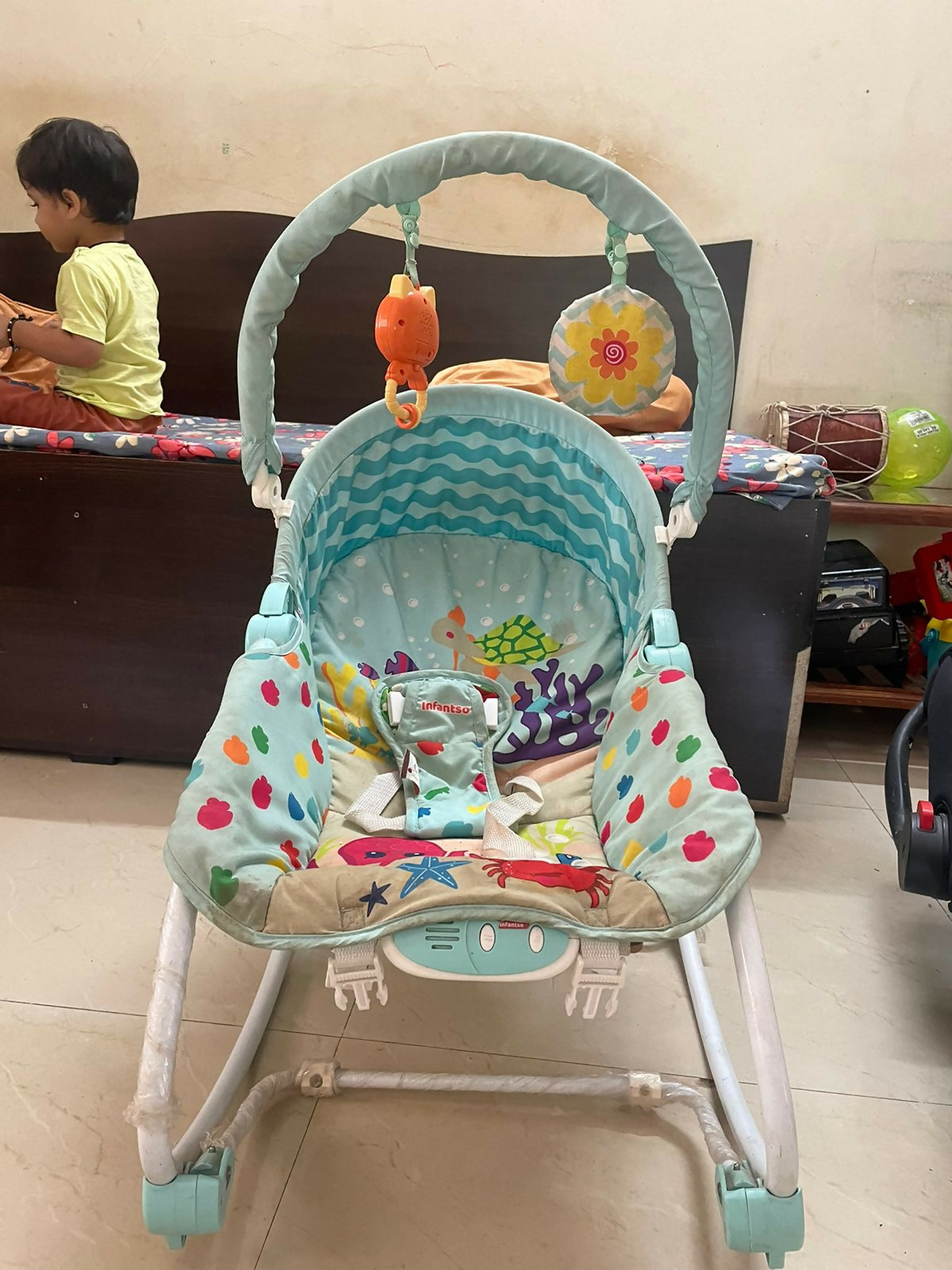 Soothe, entertain, and protect your baby with the INFANTSO Baby Rocker & Bouncer—complete with calming vibrations, music, a mosquito net, and more!