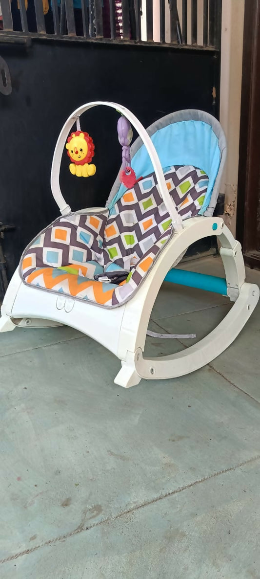 Shop now for the MIS AND CHIEF Rocker Cum Chair for Babies, offering dual functionality, safety, and comfort with a soft padded seat and secure harness!