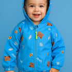 Child wearing a blue jacket with bear prints 