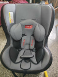 Gray and black car seat with LuvLap branding on a concrete floor.
