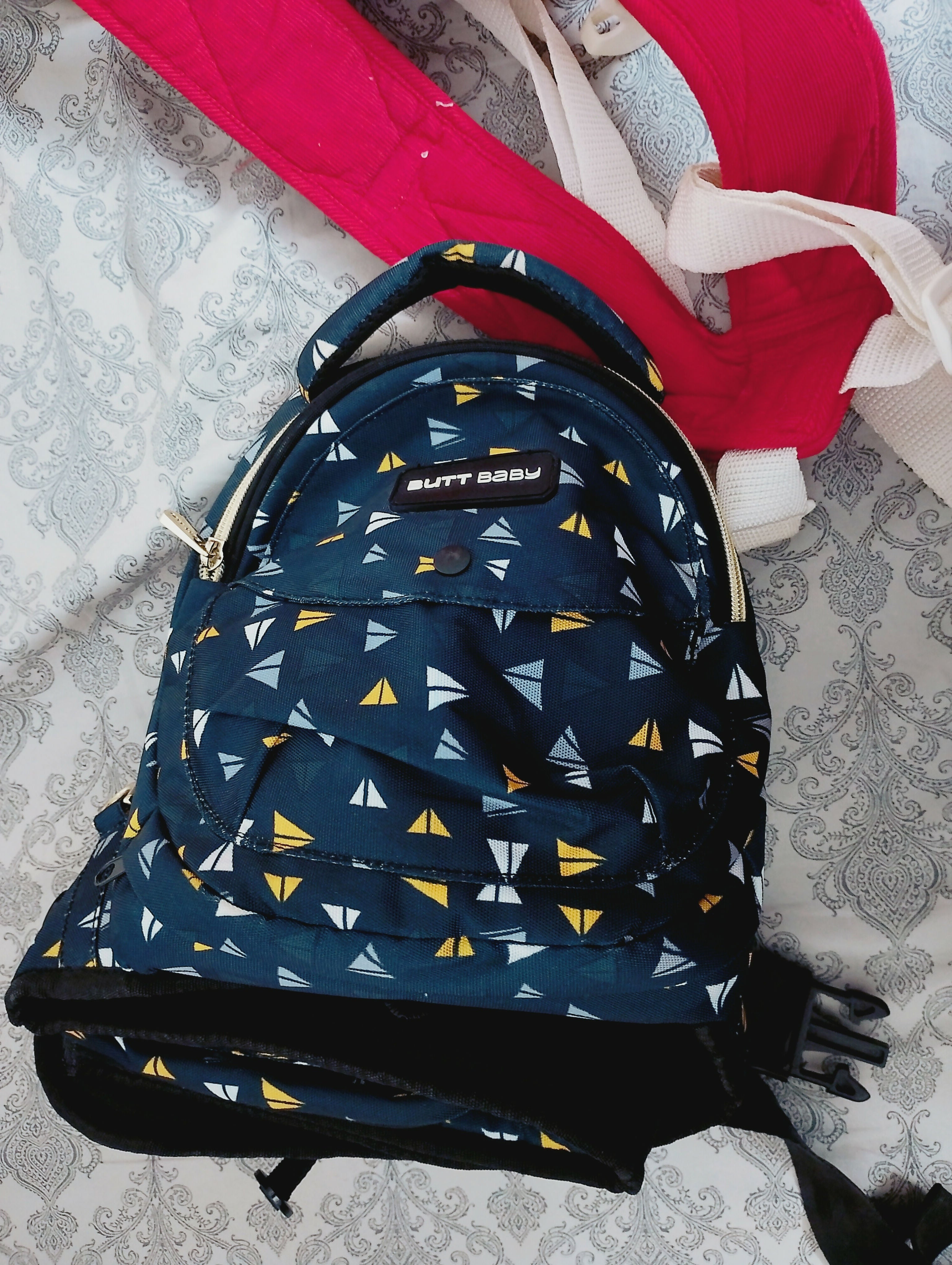 Blue bag with geometric pattern on a textured surface