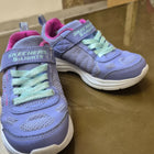 Purple children's sneakers with green laces 