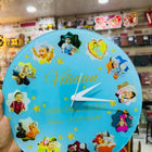 Decorative clock with cartoon characters and text 