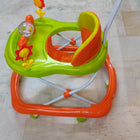 Children's walker with colorful toys on a tiled floor