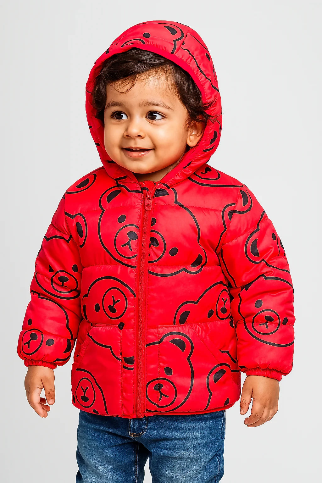 Child wearing a red jacket with black bear patterns 