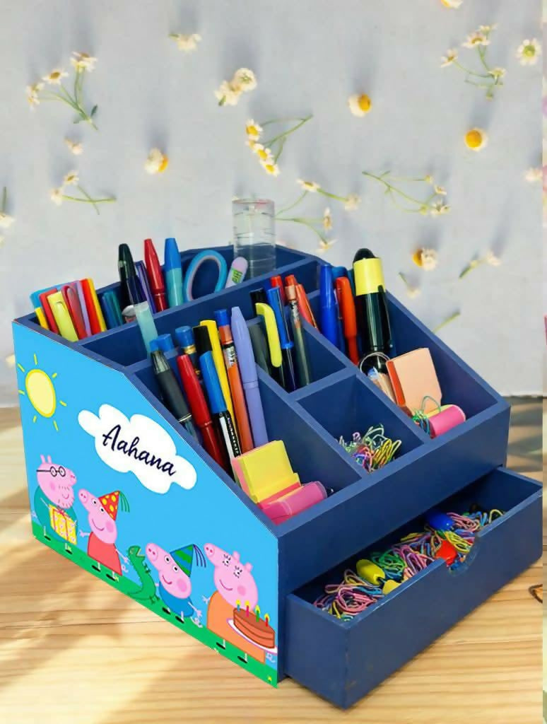 Blue children's desk organizer with stationery items 