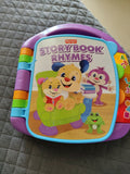 Fisher-Price Story Book Rhymes toy on a quilted surface